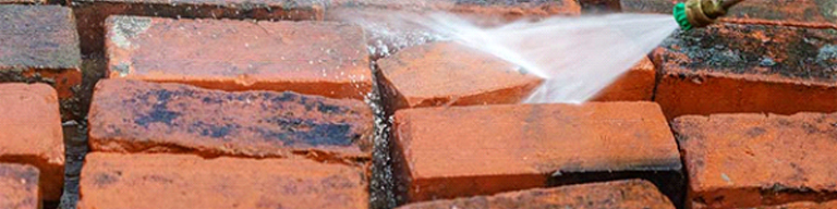 Spraying stained bricks