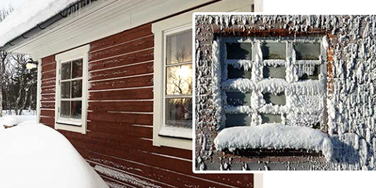 Icy and snowing siding on a house
