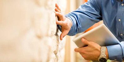 Inspecting a foundation wall