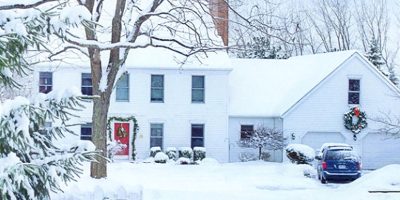 Home in winter covered with snow