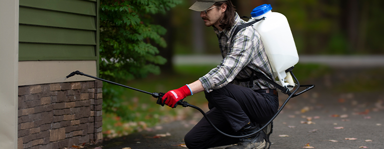 Cleaning the foundation of a house outside with Chapin's 60175 backpack sprayer