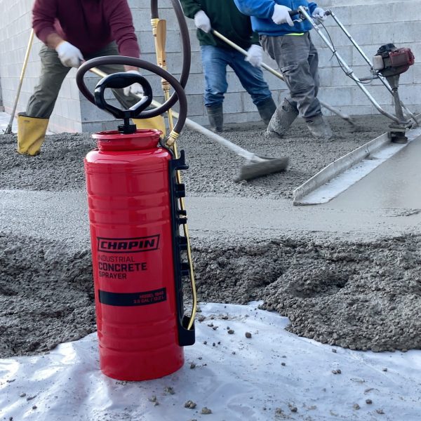 Chapin 1949 concrete industrial sprayer on a job site with poured concrete