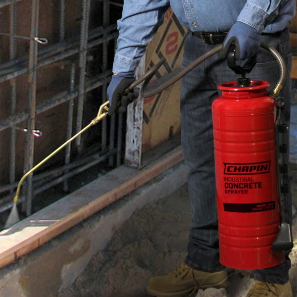 Chapin 1949 Industrial Concrete Sprayer spraying concrete foundation on construction site