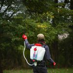 Chapin 63950 Mixes on Exit 4 Gallon Backpack Sprayer spraying trees