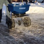 Chapin 82088B 80 Pound Professional SureSpread Salt and Ice Melt Spreader with Baffles outside spreading ice melt