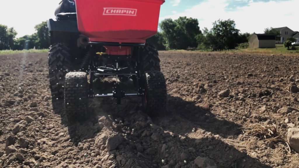 Chapin 8622B in field spreading seed