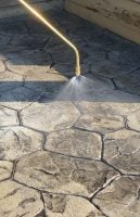 Spraying stamped concrete with Chapin concrete sprayer