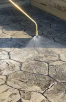 Spraying stamped concrete with Chapin concrete sprayer