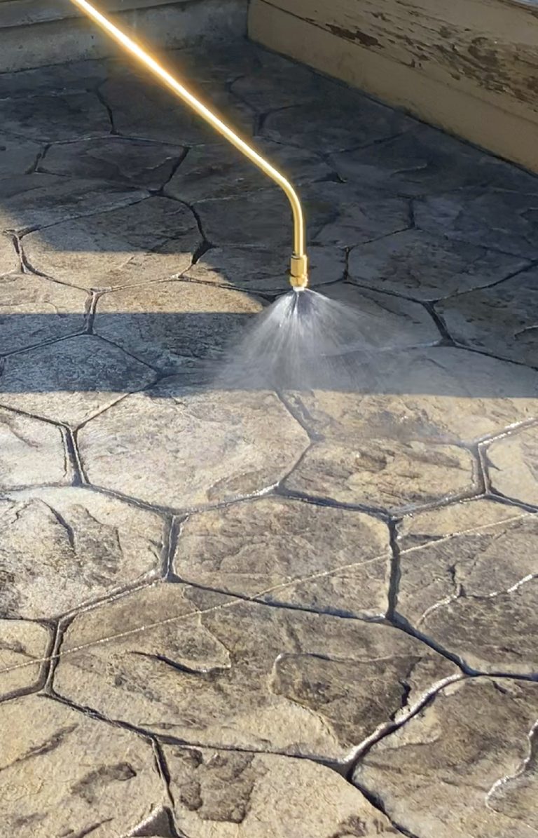 Spraying stamped concrete with Chapin concrete sprayer