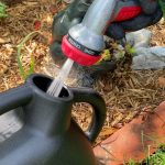 Chapin 2 Gallon watering can filling with a Chapin garden hose nozzle