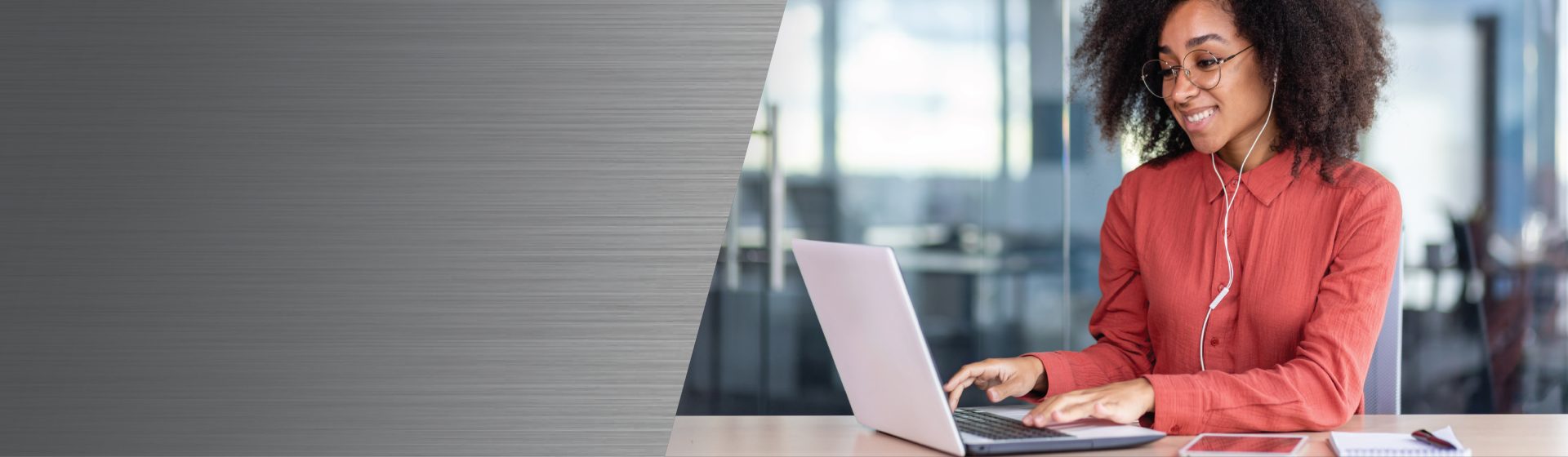 Contact Chapin for tech support, order inquiries, and product information - woman sitting at a laptop with ear buds in working