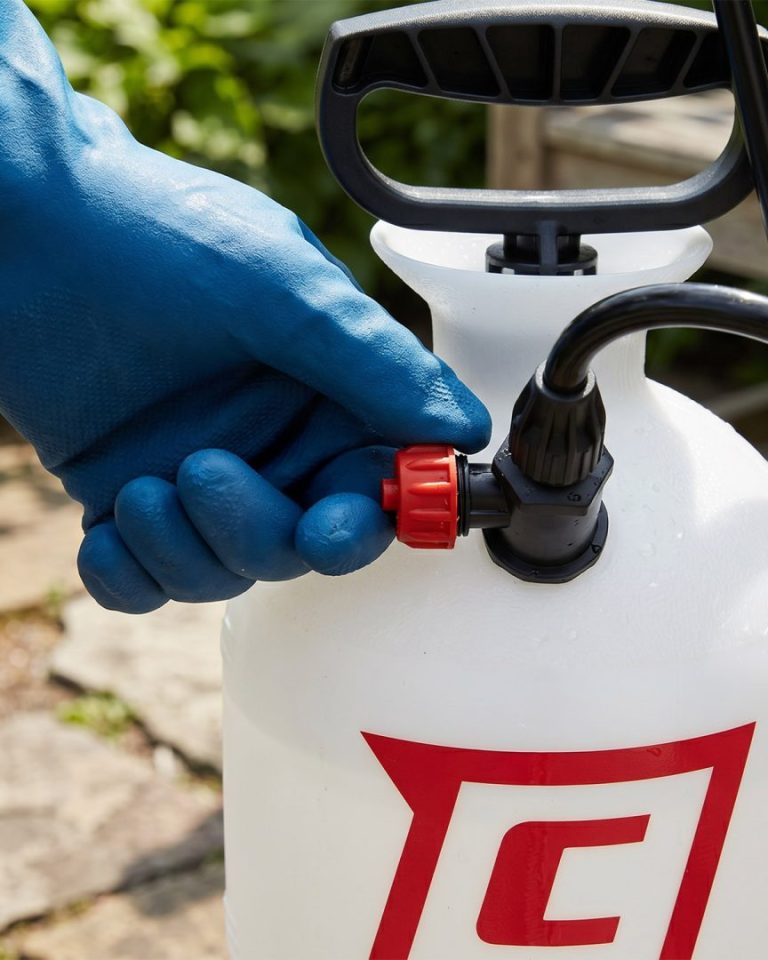 Releasing tank pressure by twisting the pressure relief valve on a Chapin SureSpray sprayer